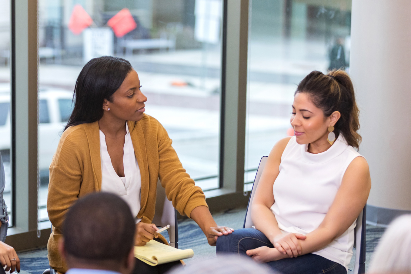 The therapist encourages her client